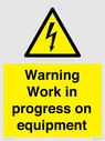warning-work-in-progress-on-equipmentwith-electrical-hazard-symbol~